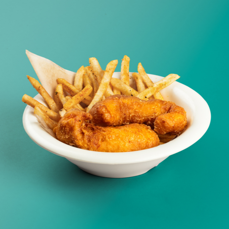 A basket of chicken tenders with fries